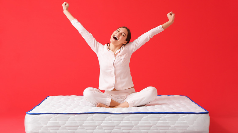 woman sitting on a mattress