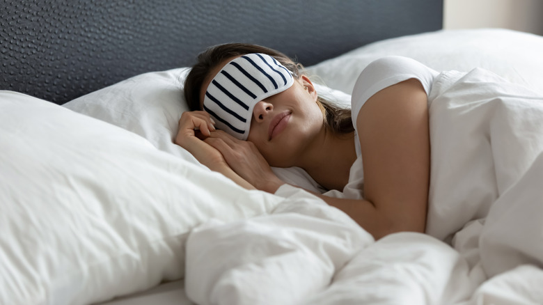 Woman sleeping with sleep mask