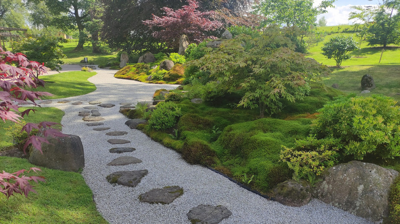 pea gravel and stone pathway through a garden