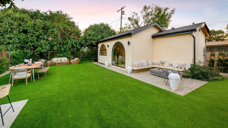 Backyard with a lush green lawn