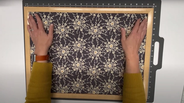 Woman making DIY linen board