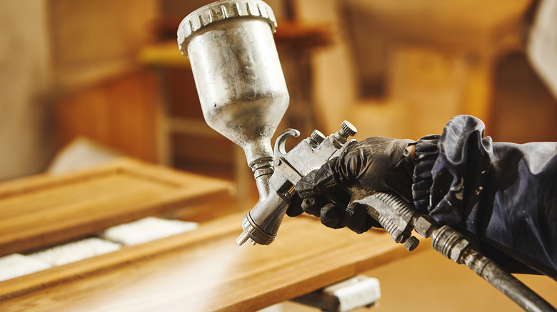 Painting with a sprayer onto wood