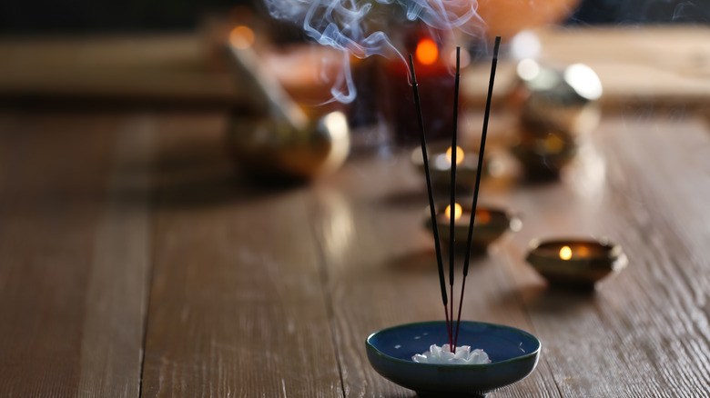 Incense burning on table