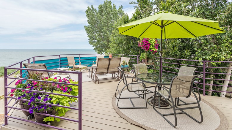 Deck with green patio umbrella