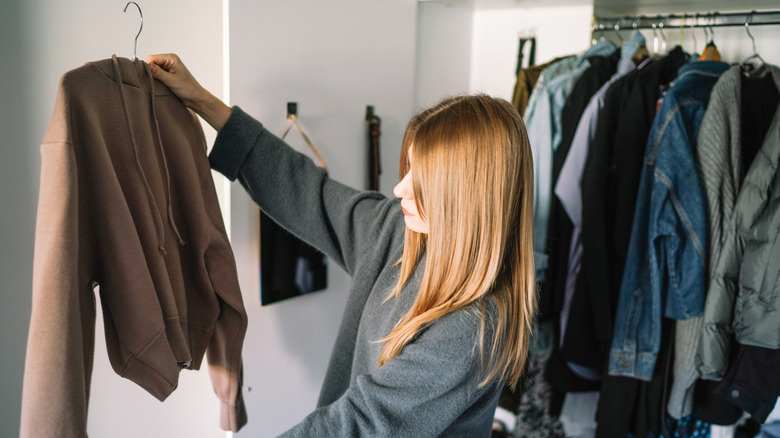 Woman organizing closet