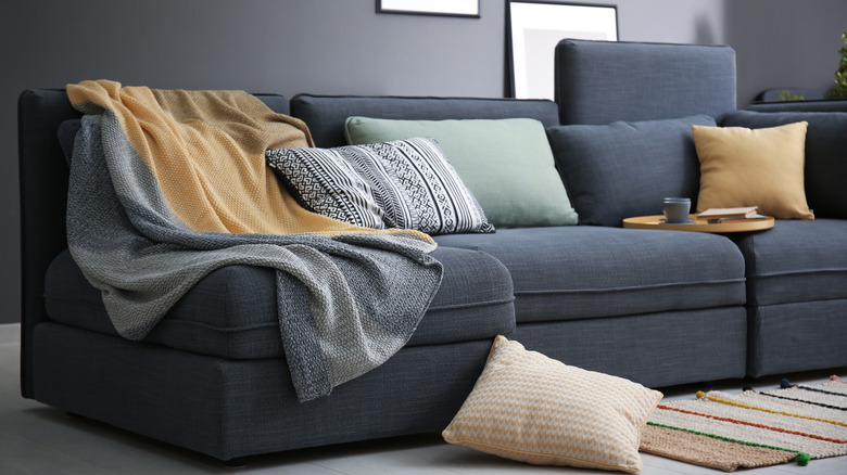 sectional sofa with pillows and blankets