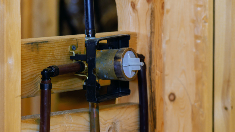 Shower installation rough-in with the pressure balancing valve visible