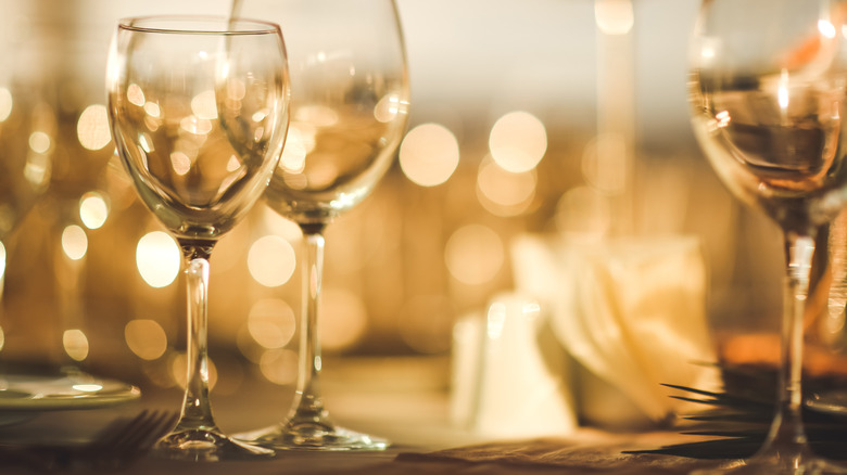 Three empty wine glasses on a table