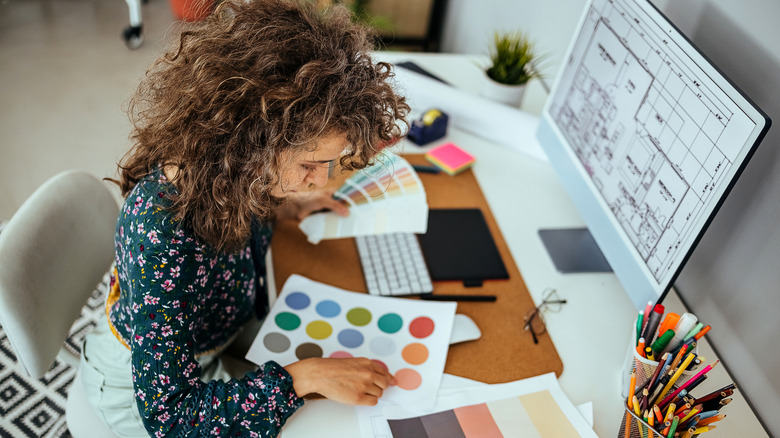 Designer looking at color swatches