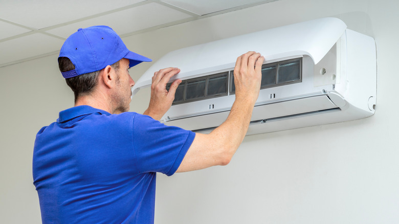 Man inspecting HVAC unit