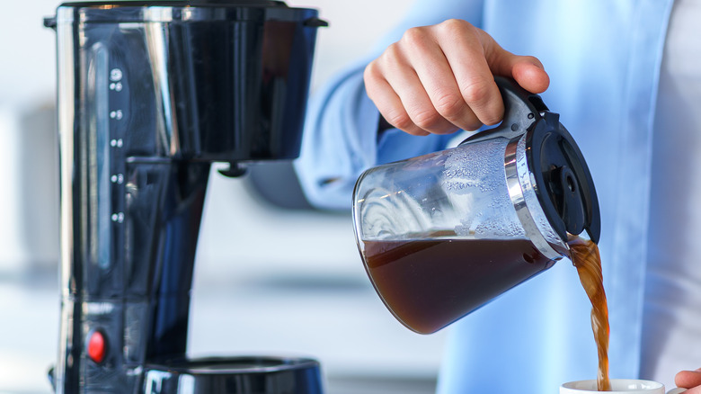 woman pouring coffee