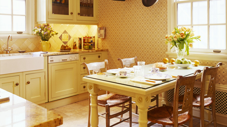 An all yellow rustic 90s kitchen.