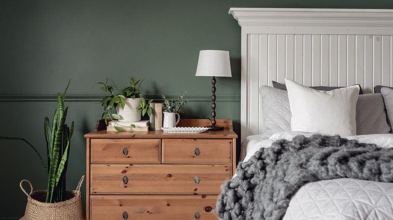white bed in green room