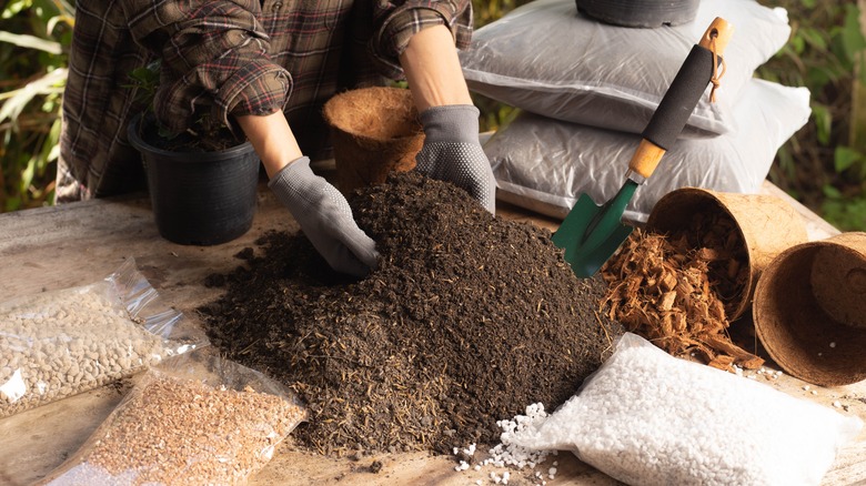 woman mixing garden soil