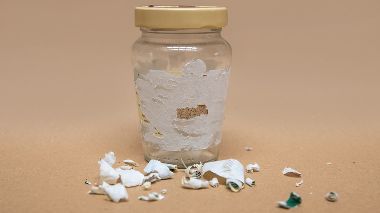 Jar with half-peeled label 