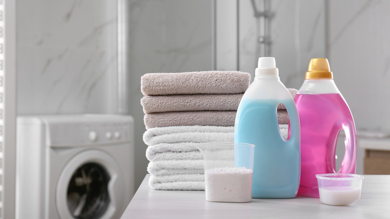 laundry detergent bottles stacked towels