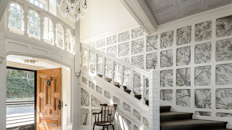 Carved staircase with hand painted trees