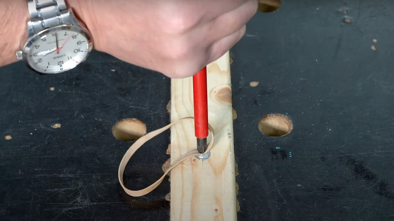 Rubber band on stripped screw