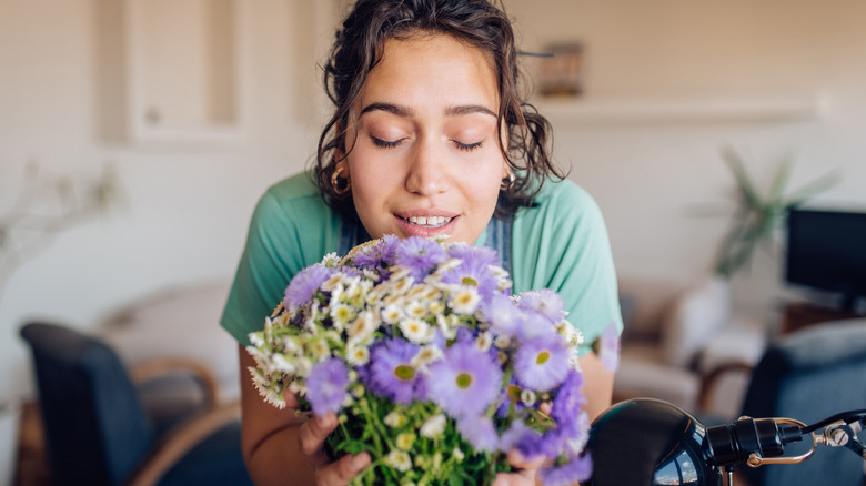 A lady relaxing with some flowers 