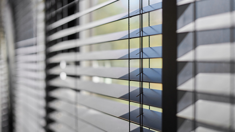 Window blinds letting in sunlight