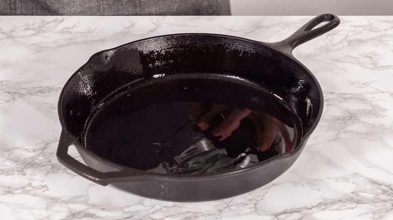 Cast iron pan coated with oil