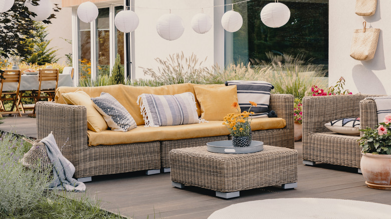 Outdoor rattan sofa and footstool