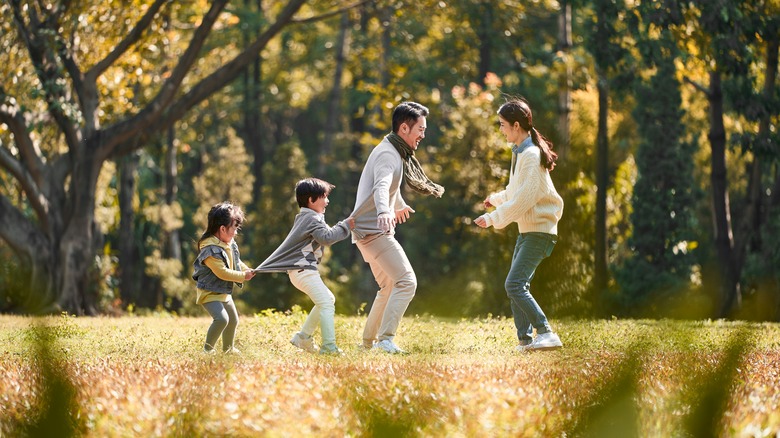 Family playing on lawn