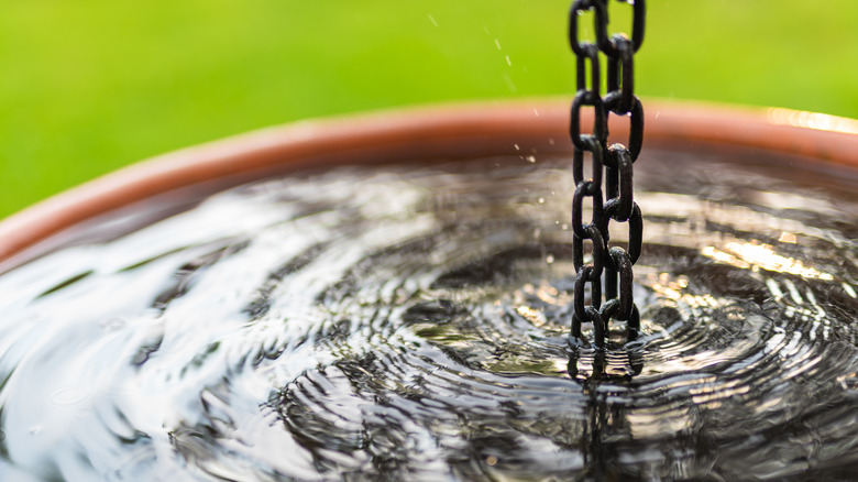 Water flowing down rain chain