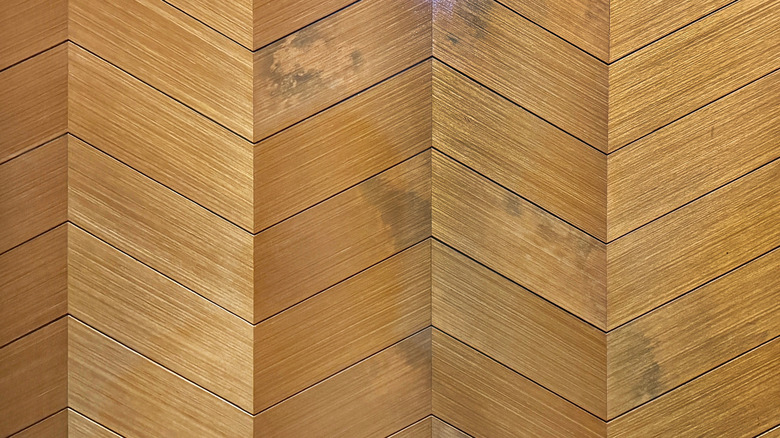A close up on chevron hardwood floors.