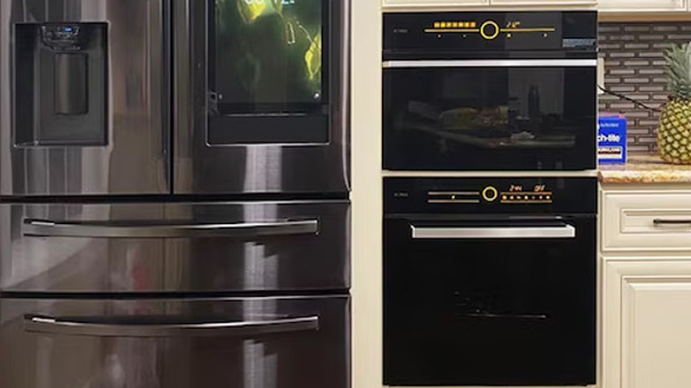 Steam oven beside fridge