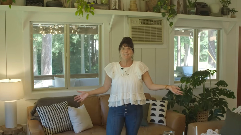 Lyndsay Lamb's in her living room surrounded by houseplants