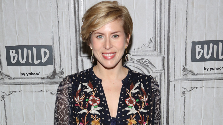Erin Napier smiling in patterned dress