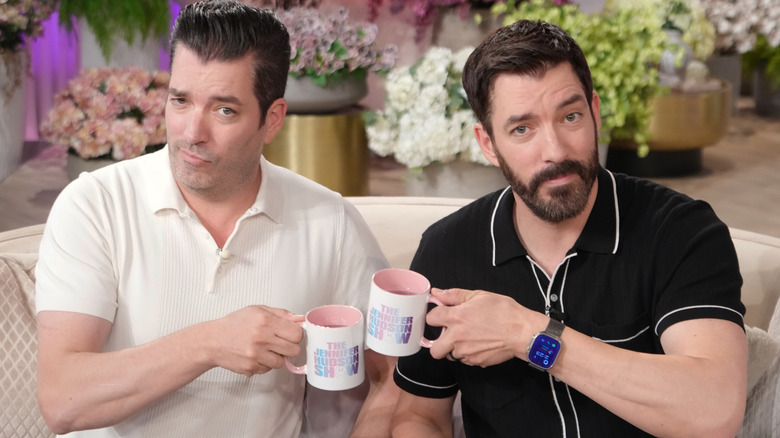 The Property Brothers clinking coffee mugs