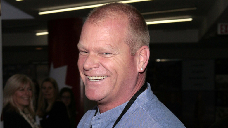 HGTV's Mile Holmes smiling at an event