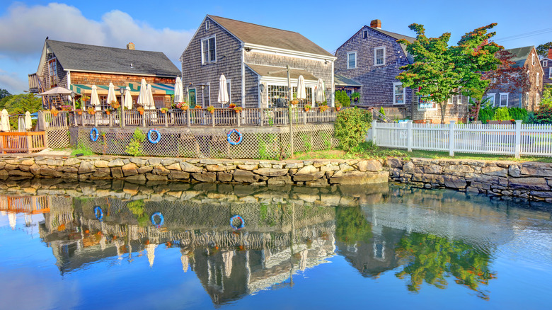 New England houses reflecting in the water in Wickford, Rhode Island.