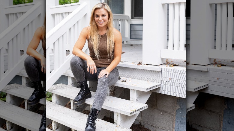 Cristy Lee posing on staircase