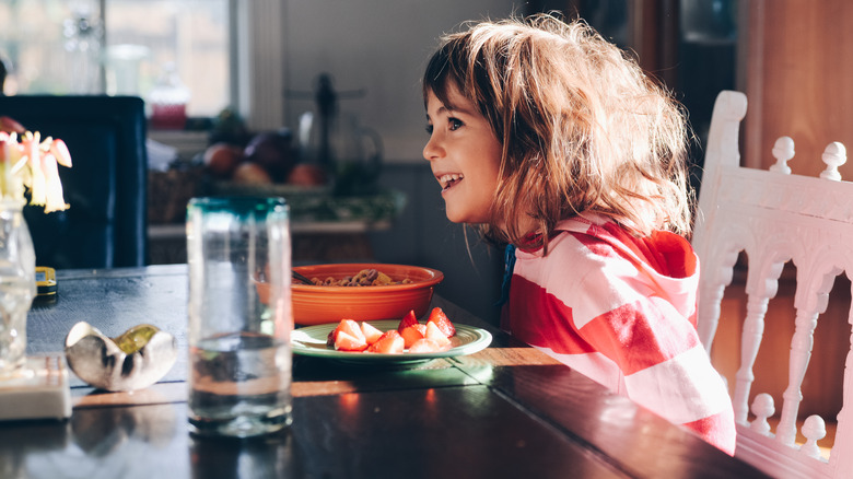 kid at dining room table