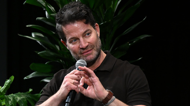 Nate Berkus speaks on stage at a 2025 eco-summit