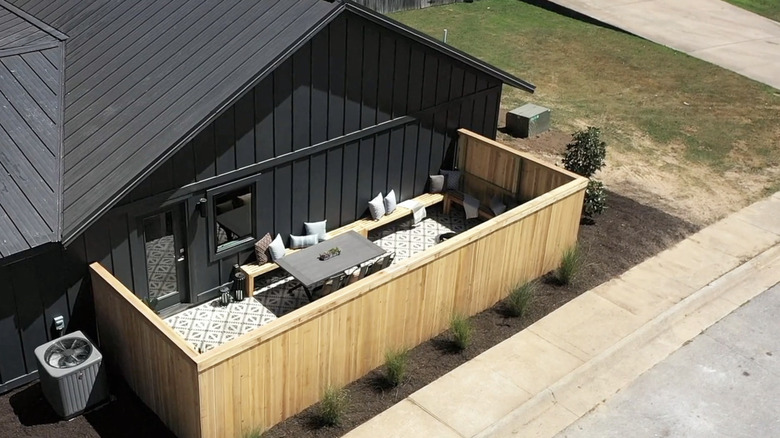 Aerial view of patio enclosed by large wooden fence