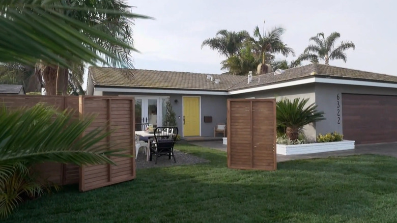Two part wooden fence in front yard
