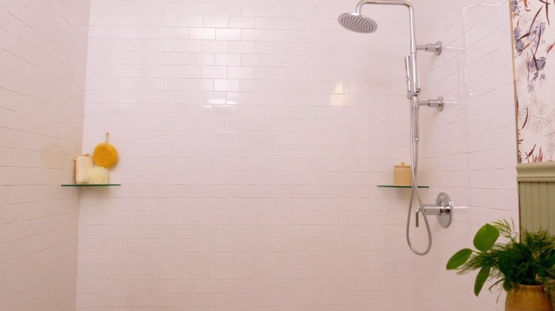Modern shower with white subway tiles.