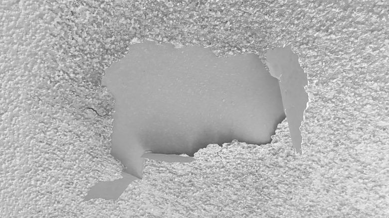 Popcorn ceiling coming loose