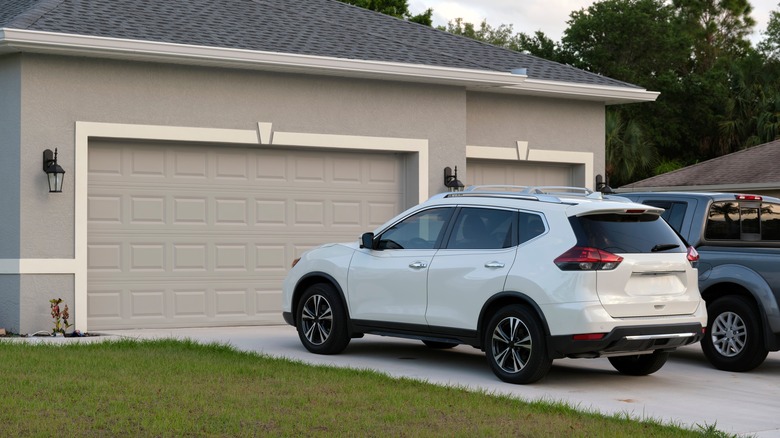 garage with car out front