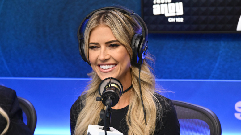 Christina Haack smiling during appearance on the "Jeff Lewis Live" radio show at SiriusXM Studios on January 10, 2025 in Los Angeles, California