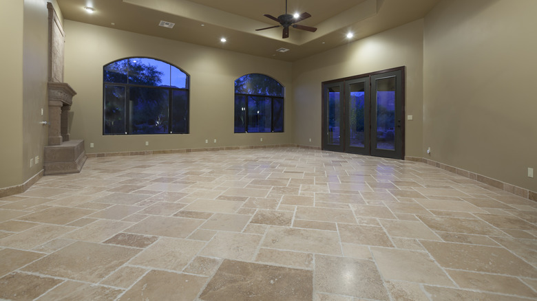 Empty living room with travertine flooring tiles
