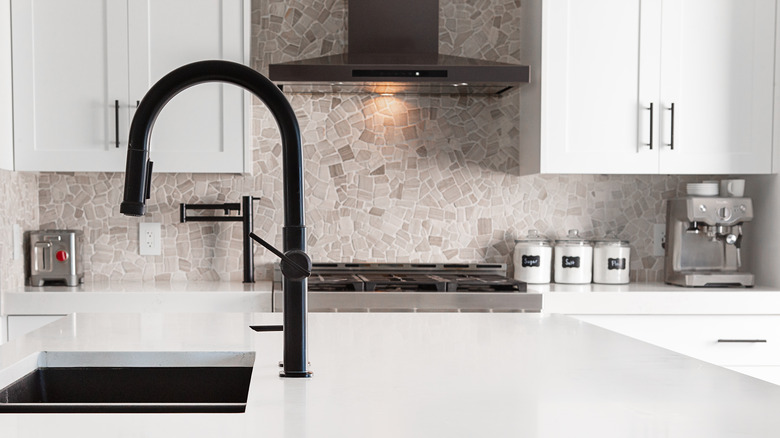 Kitchen with stone backsplash