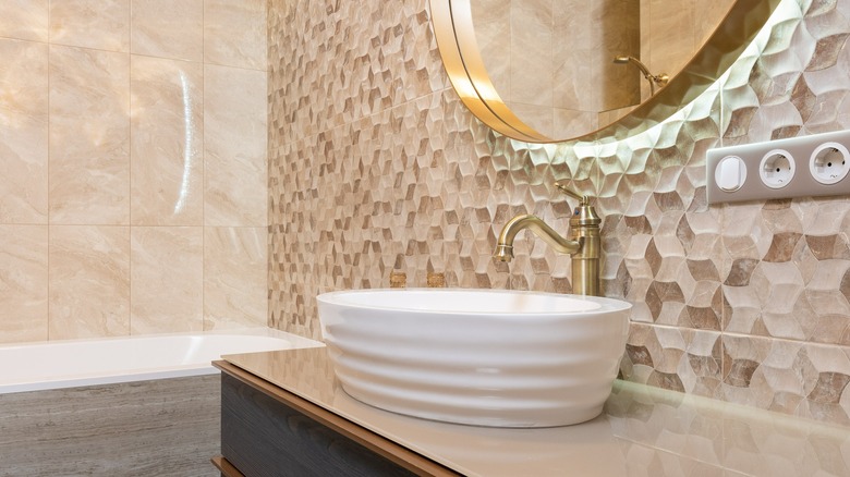 Bathroom with beige marble and tile