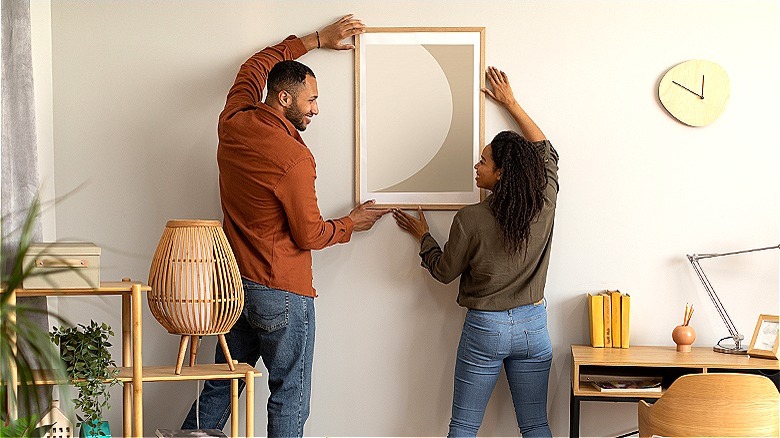 Couple hanging wall art together