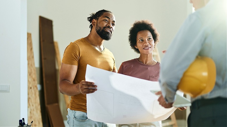 Couple discussing floor plans