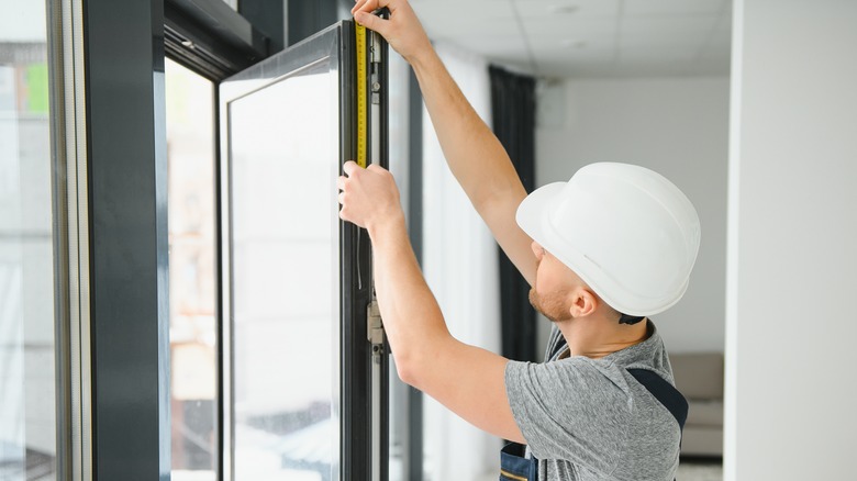 person installing new windows